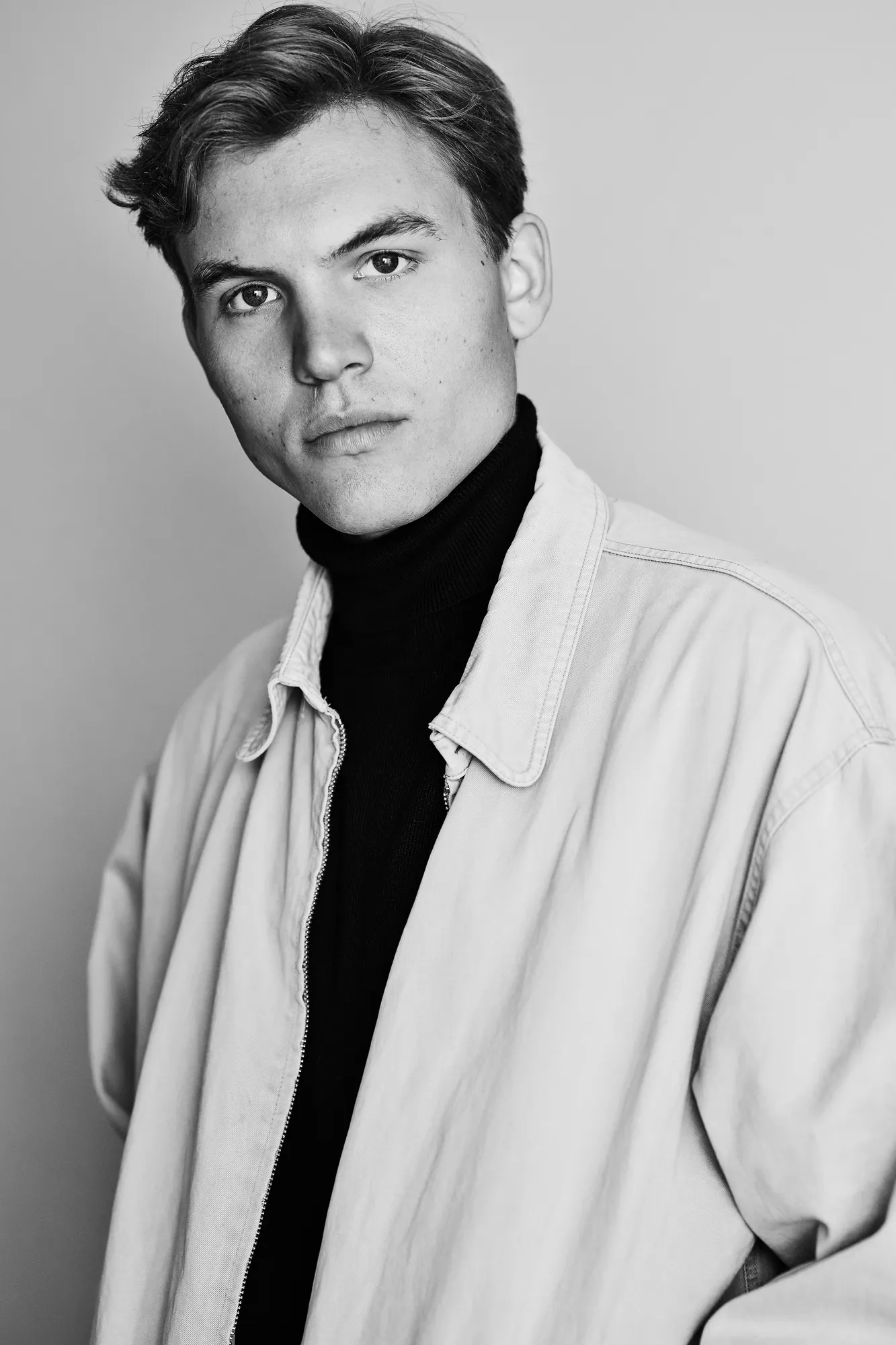 Ferdinand McKay black and white portrait in open jacket