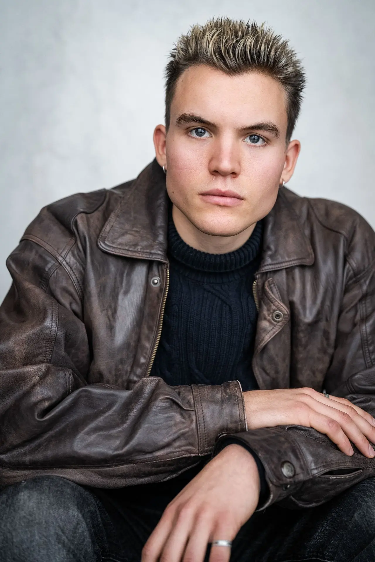 Ferdinand McKay actor headshot in brown leather jacket
